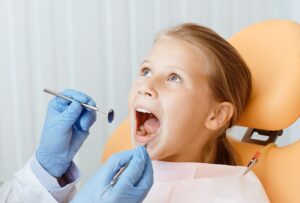 Children's dentistry and examination of teeth of small patient
